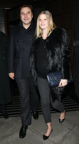 For date night with her husband, David Walliams, in London, a pregnant Lara Stone covered up in a black fur jacket, a black sweater, gray leggings, black flats, and a navy Chanel bag.
For date night with her husband, David Walliams, in London, a pregnant Lara Stone covered up in a black fur jacket, a black sweater, gray leggings, black flats, and a navy Chanel bag.