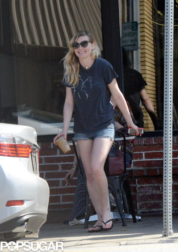 Kirsten Dunst smiled as she carried her iced coffee to the car.
Kirsten Dunst smiled as she carried her iced coffee to the car.