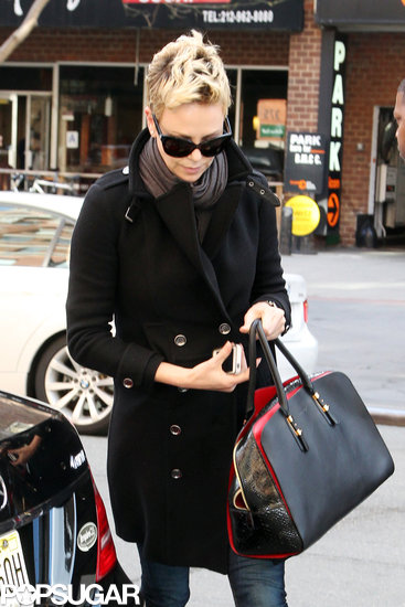 Charlize Theron carried a purse and her iPhone in NYC.
Charlize Theron carried a purse and her iPhone in NYC.