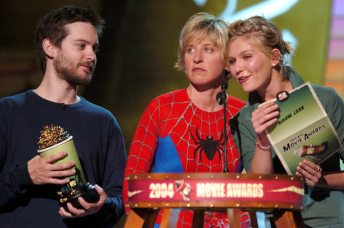 Ellen DeGeneres looked on in her Spider-Man costume as Kirsten Dunst and Tobey Maguire presented the award for best movie in 2004.
Ellen DeGeneres looked on in her Spider-Man costume as Kirsten Dunst and Tobey Maguire presented the award for best movie in 2004.