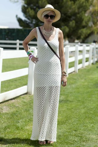 A chic festival party look comprised a bohemian knit maxi dress and chic accessories.
A chic festival party look comprised a bohemian knit maxi dress and chic accessories.