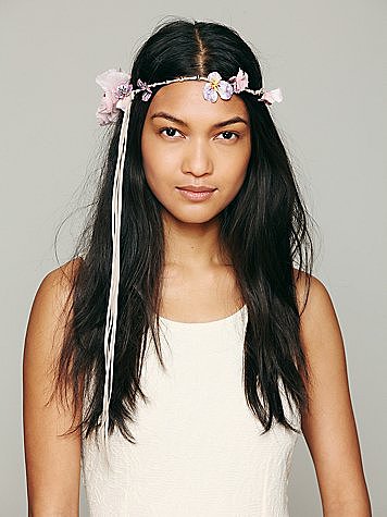 Nothing says carefree hippie (but not cheesy) bride like Free People's Madeline floral halo ($58) headpiece.
Nothing says carefree hippie (but not cheesy) bride like Free People's Madeline floral halo ($58) headpiece.