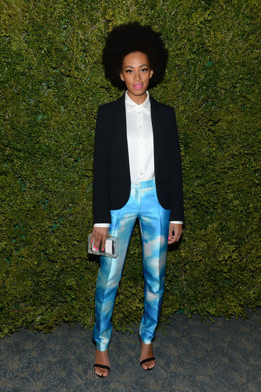 Solange Knowles made a chic arrival in a pair of Michael Kors cloud-print trousers, black blazer, white blouse, and standout accessories.
Solange Knowles made a chic arrival in a pair of Michael Kors cloud-print trousers, black blazer, white blouse, and standout accessories.