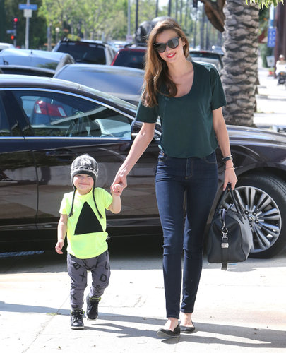 Miranda Kerr made jeans and a t-shirt look chicer than your average casual combo by sticking to dark, skinny denim and finishing with a luxe satchel and classic ballet flats. Like mom, like son — Flynn looked adorable in a beanie and a neon tee at her side.
Miranda Kerr made jeans and a t-shirt look chicer than your average casual combo by sticking to dark, skinny denim and finishing with a luxe satchel and classic ballet flats. Like mom, like son — Flynn looked adorable in a beanie and a neon tee at her side.