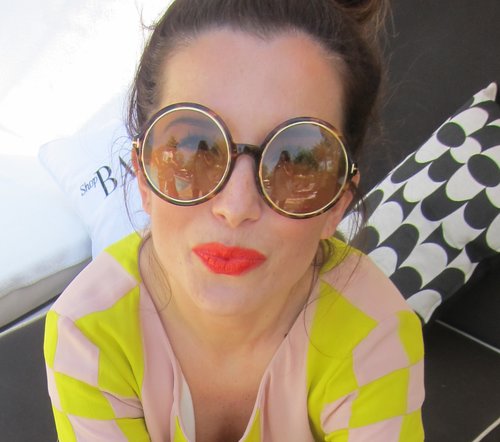 Eccentric and iconic big round glasses are even more powerful when paired with a bright coral lip.
Eccentric and iconic big round glasses are even more powerful when paired with a bright coral lip.