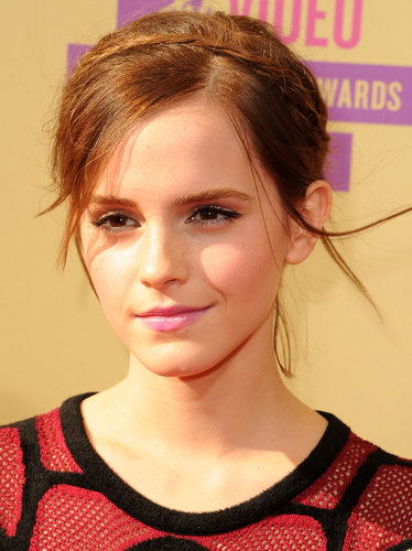 For the 2012 MTV Video Music Awards, Emma paired a delicate headband braid with inky black liner and bubblegum-pink lips.
For the 2012 MTV Video Music Awards, Emma paired a delicate headband braid with inky black liner and bubblegum-pink lips.
