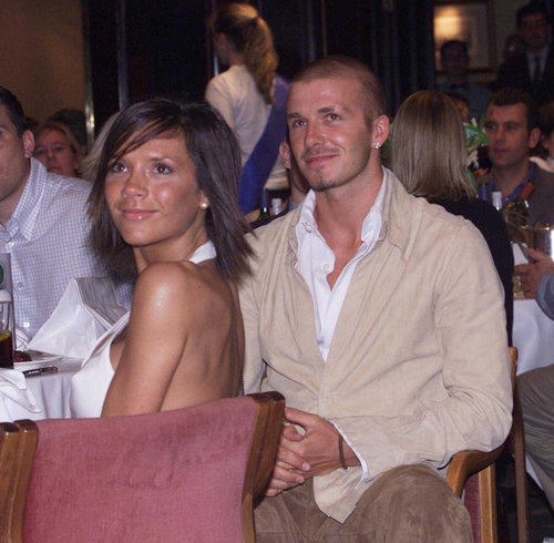 David and Victoria Beckham stuck together at a London event in June 2001.
David and Victoria Beckham stuck together at a London event in June 2001.
