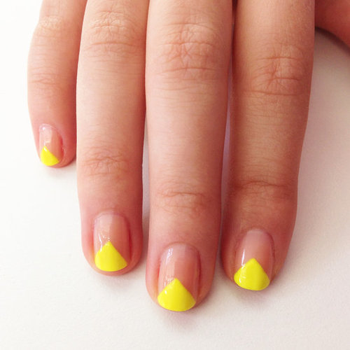 Take the edge of your favorite neon polish up a few notches with this easy-to-DIY V-shaped manicure idea.
Take the edge of your favorite neon polish up a few notches with this easy-to-DIY V-shaped manicure idea.