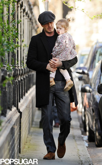 David Beckham carried Harper through Notting Hill in London.
David Beckham carried Harper through Notting Hill in London.