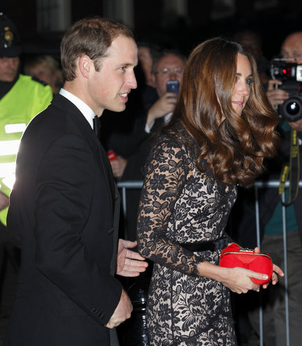 The couple attended a University of St. Andrews dinner in style — with Kate wearing a lacy Alice Temperley gown and red Alexander McQueen clutch.
The couple attended a University of St. Andrews dinner in style — with Kate wearing a lacy Alice Temperley gown and red Alexander McQueen clutch.