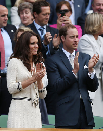 For their appearance at Wimbledon 2012, Kate wore a navy-and-cream sailor-inspired dress by Alexander McQueen.
For their appearance at Wimbledon 2012, Kate wore a navy-and-cream sailor-inspired dress by Alexander McQueen.