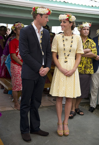 The couple posed — both with floral wreaths on their heads — on day eight of their Diamond Jubilee tour. For a visit to Nauti Primary School in Tuvalu, Kate wore a daisy-eyelet yellow dress with tan sandals.
The couple posed — both with floral wreaths on their heads — on day eight of their Diamond Jubilee tour. For a visit to Nauti Primary School in Tuvalu, Kate wore a daisy-eyelet yellow dress with tan sandals.