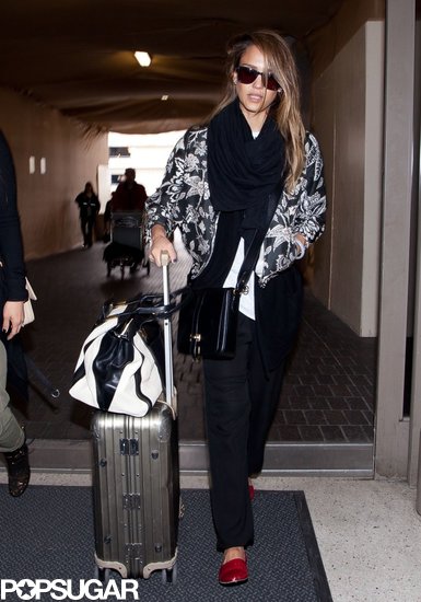 Jessica Alba arrived at LAX looking sporty-cool in this Isabel Marant floral bomber jacket ($933), a black-and-white Chloé bag, and red Jenni Kayne d'Orsay flats.
Jessica Alba arrived at LAX looking sporty-cool in this Isabel Marant floral bomber jacket ($933), a black-and-white Chloé bag, and red Jenni Kayne d'Orsay flats.