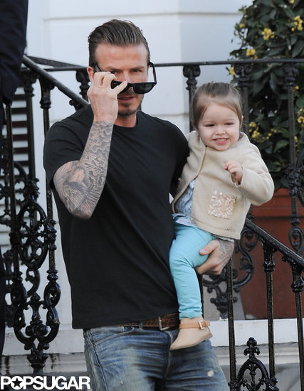 David Beckham held Harper during a morning stroll.
David Beckham held Harper during a morning stroll.