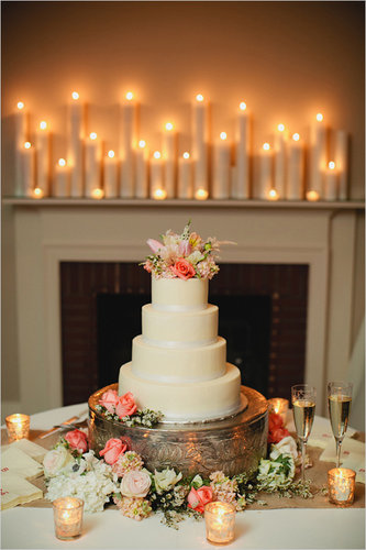 This is the perfect example of how you can take a plain tiered cake and turn it into a dessert with flair. Here, the extra details — the stand, the candles, the flowers — make it stand out, but it could just as easily look great without them.
Photo by Kristyn Hogan via Wedding Chicks
This is the perfect example of how you can take a plain tiered cake and turn it into a dessert with flair. Here, the extra details — the stand, the candles, the flowers — make it stand out, but it could just as easily look great without them.
Photo by Kristyn Hogan via Wedding Chicks