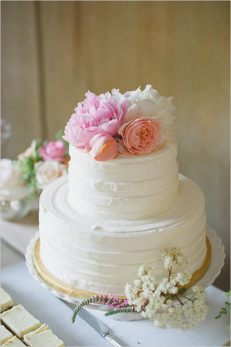 Top a buttercream-covered cake with pretty flowers, and voilà! Just like that, you've go yourself a fuss-free, beautiful dessert.
Photo by Delbarr Moradi Photography via Wedding Chicks
Top a buttercream-covered cake with pretty flowers, and voilà! Just like that, you've go yourself a fuss-free, beautiful dessert.
Photo by Delbarr Moradi Photography via Wedding Chicks
