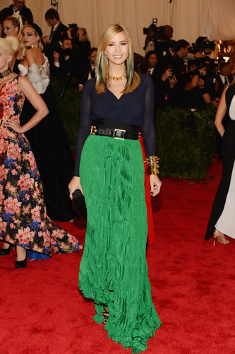 Ivanka Trump donned a green pleated skirt with gold spiked jewels from her own line, a Nancy Gonzalez clutch, and added streaks in her hair for that extra punk touch.
Ivanka Trump donned a green pleated skirt with gold spiked jewels from her own line, a Nancy Gonzalez clutch, and added streaks in her hair for that extra punk touch.