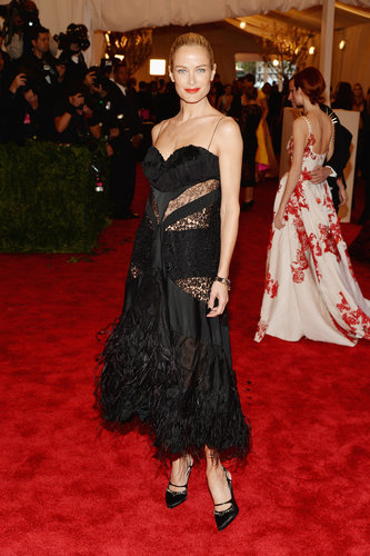 Carolyn Murphy was flirty in a black sheer lace and feather Nina Ricci by Peter Copping midi-length dress.
Carolyn Murphy was flirty in a black sheer lace and feather Nina Ricci by Peter Copping midi-length dress.