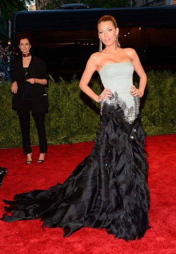 Blake Lively was every bit the movie star in her Gucci Première pale green strapless gown with silver and matte black feather embroideries. She finished off the look with Lorraine Schwartz jewels.
Blake Lively was every bit the movie star in her Gucci Première pale green strapless gown with silver and matte black feather embroideries. She finished off the look with Lorraine Schwartz jewels.