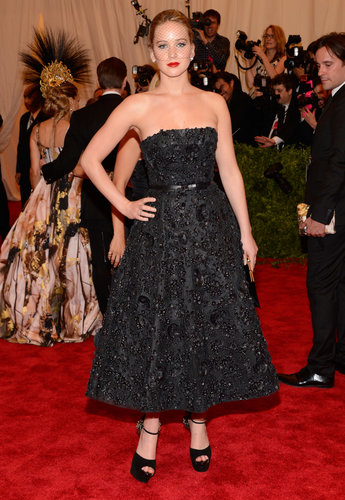 Jennifer Lawrence was the epitome of sophisticated in her black beaded Christian Dior fit-and-flare gown, black netted Jennifer Behr veil, and Brian Atwood platforms.
Jennifer Lawrence was the epitome of sophisticated in her black beaded Christian Dior fit-and-flare gown, black netted Jennifer Behr veil, and Brian Atwood platforms.