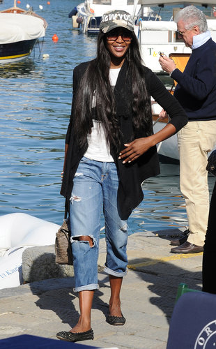 While seaside in Portofino, Naomi Campbell showed off her laid-back side in a pair of ripped boyfriend jeans. A camouflage hat, a black cardigan, studded flats, and an animal-skin bag completed her vacation style.
While seaside in Portofino, Naomi Campbell showed off her laid-back side in a pair of ripped boyfriend jeans. A camouflage hat, a black cardigan, studded flats, and an animal-skin bag completed her vacation style.