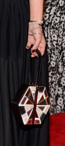Jessica Hart carried a geometric clutch and wore Chopard diamond bracelets.
Jessica Hart carried a geometric clutch and wore Chopard diamond bracelets.