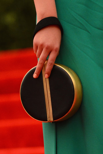 Kate Upton added interest with a circular Diane Von Furstenberg clutch.
Kate Upton added interest with a circular Diane Von Furstenberg clutch.