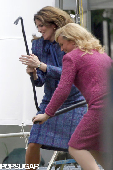 Amy Poehler and Tina Fey beat up Sacha Baron Cohen with crowbars.
Amy Poehler and Tina Fey beat up Sacha Baron Cohen with crowbars.