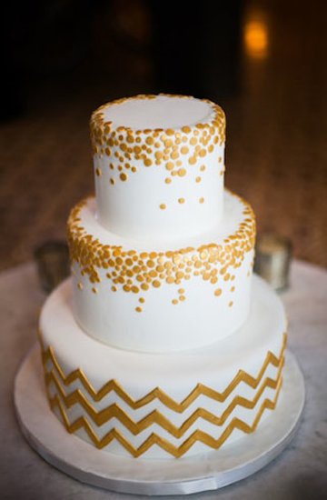 An all-white cake is given a graphic touch with a chevron base and metallic circles.
Photo by Aaron Shintaku via Green Wedding Shoes
An all-white cake is given a graphic touch with a chevron base and metallic circles.
Photo by Aaron Shintaku via Green Wedding Shoes