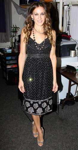 Parker's mixed-print tea dress, crystal-adorned peep-toe pumps, and dual necklaces combined to create the perfect NYC party style for a 2010 Ralph Lauren event.
Parker's mixed-print tea dress, crystal-adorned peep-toe pumps, and dual necklaces combined to create the perfect NYC party style for a 2010 Ralph Lauren event.