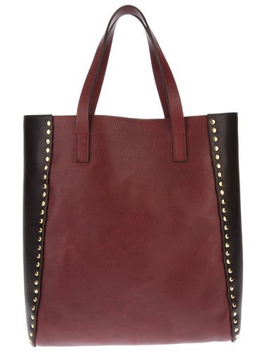 The briefcase of the '80s has been replaced by a sleek designer tote bag done in durable leather and perfectly sized to fit a laptop. In colorblocked black and brown, this Marni bag ($828) matches anything.
The briefcase of the '80s has been replaced by a sleek designer tote bag done in durable leather and perfectly sized to fit a laptop. In colorblocked black and brown, this Marni bag ($828) matches anything.