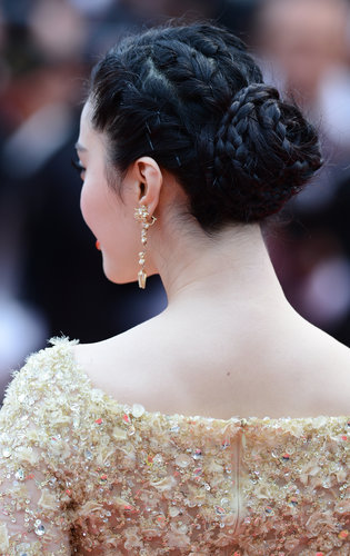 Fan Bingbing's formal updo at the Jeune & Jolie premiere at Cannes was a series of twists and braids that coalesced into a chic chignon.
Fan Bingbing's formal updo at the Jeune & Jolie premiere at Cannes was a series of twists and braids that coalesced into a chic chignon.