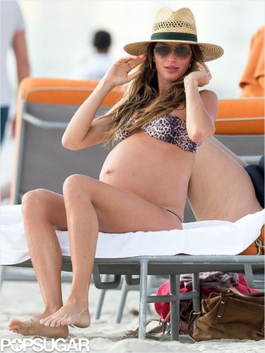 Gisele Bündchen took her bump down to Miami for a weekend getaway with husband Tom Brady this past weekend. The pregnant mama — who's expecting baby number two after the New Year — rocked an animal-print bikini on the beach and a large hat to shield her face from the sun.
Gisele Bündchen took her bump down to Miami for a weekend getaway with husband Tom Brady this past weekend. The pregnant mama — who's expecting baby number two after the New Year — rocked an animal-print bikini on the beach and a large hat to shield her face from the sun.