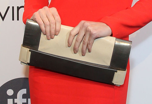 Paz Vega carried a metallic-and-beige colorblocked clutch.
Paz Vega carried a metallic-and-beige colorblocked clutch.
