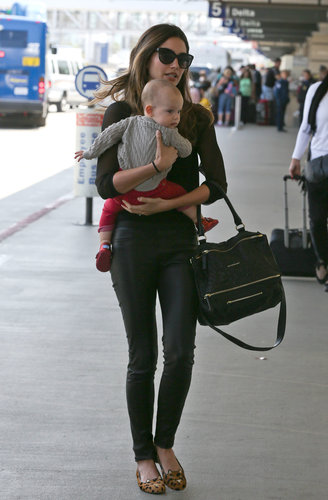 Lily Aldridge hit the airport in black leather pants, a Givenchy bag, Charlotte Olympia leopard loafers, and cat-eye sunglasses.
Lily Aldridge hit the airport in black leather pants, a Givenchy bag, Charlotte Olympia leopard loafers, and cat-eye sunglasses.