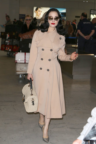 Dita Von Teese put her trench coat to good use at the airport. We imagine she's wearing something equally fabulous underneath, but you know, if not, we'd never be able to tell. Just finish the look with polished accessories and a bold red lip for a luxe travel style you might have sworn you saw on Mad Men.
Dita Von Teese put her trench coat to good use at the airport. We imagine she's wearing something equally fabulous underneath, but you know, if not, we'd never be able to tell. Just finish the look with polished accessories and a bold red lip for a luxe travel style you might have sworn you saw on Mad Men.