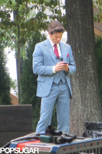 James Marsden took a quick cell phone break while decked out in '70s gear.
James Marsden took a quick cell phone break while decked out in '70s gear.
