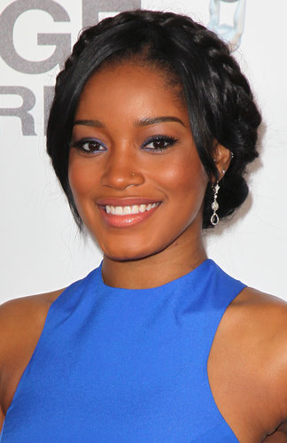 A more polished styling of milkmaid braids, like Keke Palmer wore at the NAACP Image Awards, is a great option for a Summer wedding.
A more polished styling of milkmaid braids, like Keke Palmer wore at the NAACP Image Awards, is a great option for a Summer wedding.