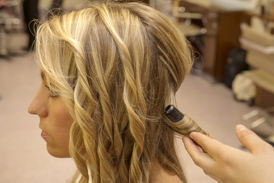 Next, use a curling iron to create beach waves or to enhance your hair's natural texture. Guillen recommends using a smaller barrel for thinner hair, while thicker hair can use larger barrels.
Next, use a curling iron to create beach waves or to enhance your hair's natural texture. Guillen recommends using a smaller barrel for thinner hair, while thicker hair can use larger barrels.