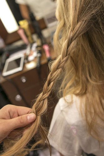 Take a small section of hair that's slightly to the left of the center of the back of your head and create a loose regular braid.
Take a small section of hair that's slightly to the left of the center of the back of your head and create a loose regular braid.