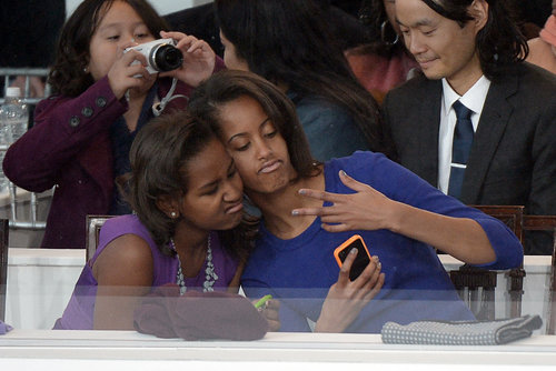 In January 2013, Malia Obama and Sasha Obama got silly for a selfie while sitting in the stands during the 2013 Presidential Inauguration Parade.
In January 2013, Malia Obama and Sasha Obama got silly for a selfie while sitting in the stands during the 2013 Presidential Inauguration Parade.