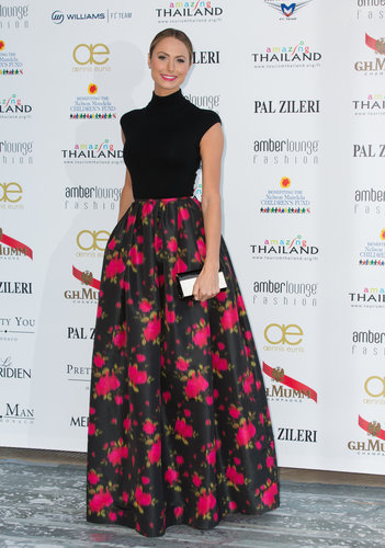 Stacy Keibler made her own red carpet moment, pairing a black knit top and ball skirt, both from Michael Kors's pre-Fall 2013 collection.
Stacy Keibler made her own red carpet moment, pairing a black knit top and ball skirt, both from Michael Kors's pre-Fall 2013 collection.
