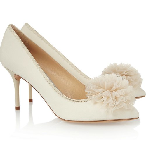 Pair a classic, low-heeled white pump — like these Charlotte Olympia pom-pom pumps ($900) — with a tea-length dress for an altogether retro feel. While the closed-toe look is fair game in the colder months, this style totally goes with shorter dress lengths year-round.
Pair a classic, low-heeled white pump — like these Charlotte Olympia pom-pom pumps ($900) — with a tea-length dress for an altogether retro feel. While the closed-toe look is fair game in the colder months, this style totally goes with shorter dress lengths year-round.