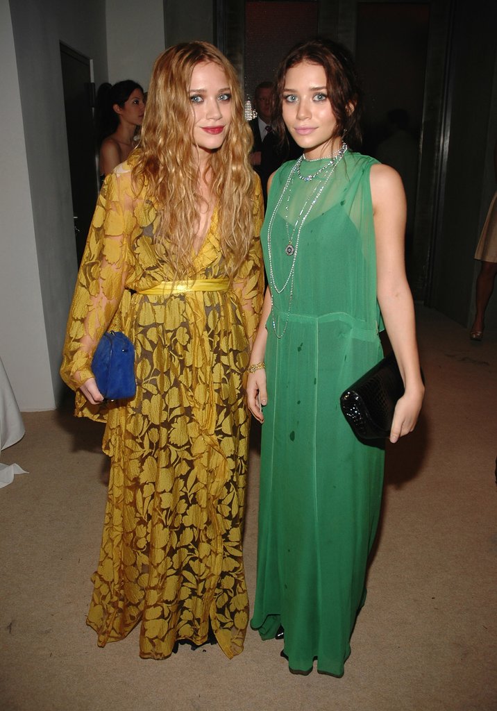 Twinning combo: For the 2006 CFDA/Vogue Fashion Fund Awards, the girls donned Autumn-friendly hues and textured box clutches.
Mary-Kate was Fall-ready in a leafy mustard-yellow wrap gown and suede cobalt clutch.
Ashley played up her dark locks in a sheer green dress, black patent leather clutch, and a few layered necklaces.
Twinning combo: For the 2006 CFDA/Vogue Fashion Fund Awards, the girls donned Autumn-friendly hues and textured box clutches.
Mary-Kate was Fall-ready in a leafy mustard-yellow wrap gown and suede cobalt clutch.
Ashley played up her dark locks in a sheer green dress, black patent leather clutch, and a few layered necklaces.