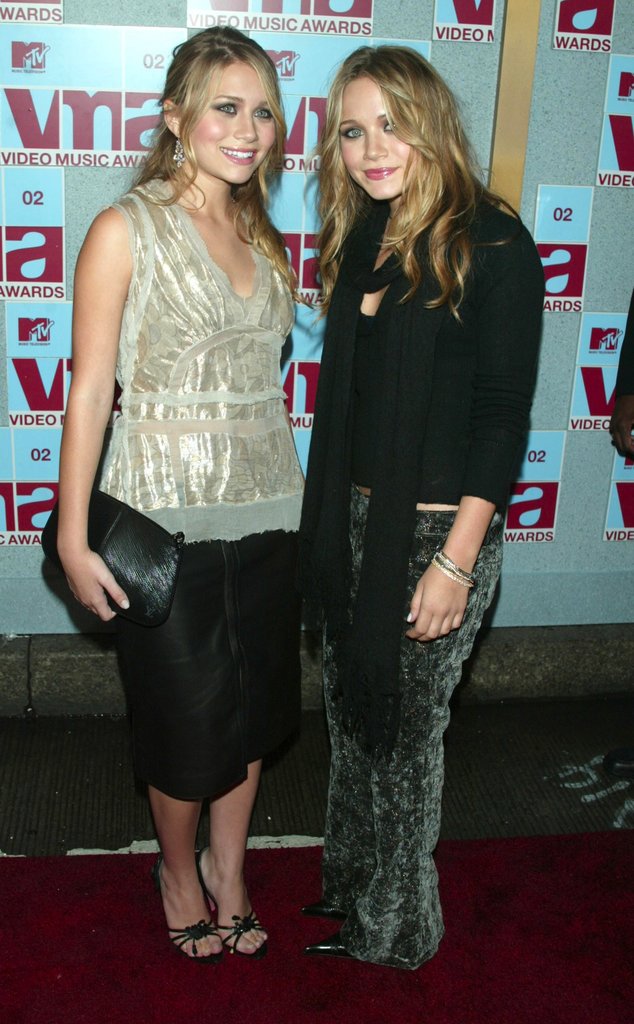 Twinning combo: At the 2002 MTV VMAs, the Olsens partied the night away in age-appropriate ensembles.
Ashley tempered her leather pencil skirt with an iridescent blouse and black sandals.
Mary-Kate stood out in printed velour pants.
Twinning combo: At the 2002 MTV VMAs, the Olsens partied the night away in age-appropriate ensembles.
Ashley tempered her leather pencil skirt with an iridescent blouse and black sandals.
Mary-Kate stood out in printed velour pants.