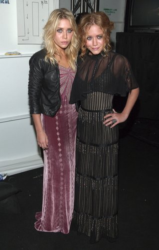 Twinning combo: During Fall 2006 NYFW season, the designing duo opted for decadent gowns and soft curls.
Ashley roughed up her blush velour gown, complete with sparkling bodice, with a cropped leather jacket.
Mary-Kate's sheer, tiered, and bead-embellished gown was absolutely stunning.
Twinning combo: During Fall 2006 NYFW season, the designing duo opted for decadent gowns and soft curls.
Ashley roughed up her blush velour gown, complete with sparkling bodice, with a cropped leather jacket.
Mary-Kate's sheer, tiered, and bead-embellished gown was absolutely stunning.