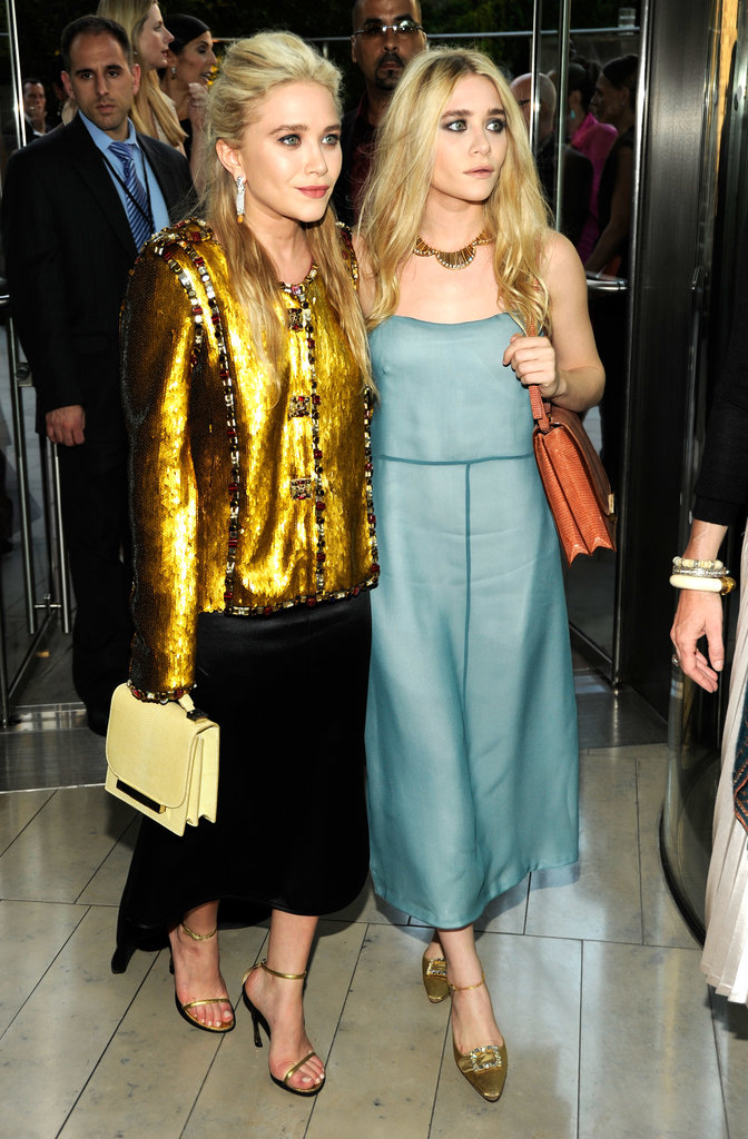 Twinning combo: For the 2011 CFDA Fashion Awards, both girls kicked it into high gear with high-shine pieces.
Mary-Kate donned an embellished gold Chanel topper, black high-low skirt, and pastel bag by The Row.
Ashley went a little more subtle in a sheen, baby-blue creation and burnt-orange crocodile bag, both by The Row, with metallic ankle-strap pumps.
Twinning combo: For the 2011 CFDA Fashion Awards, both girls kicked it into high gear with high-shine pieces.
Mary-Kate donned an embellished gold Chanel topper, black high-low skirt, and pastel bag by The Row.
Ashley went a little more subtle in a sheen, baby-blue creation and burnt-orange crocodile bag, both by The Row, with metallic ankle-strap pumps.