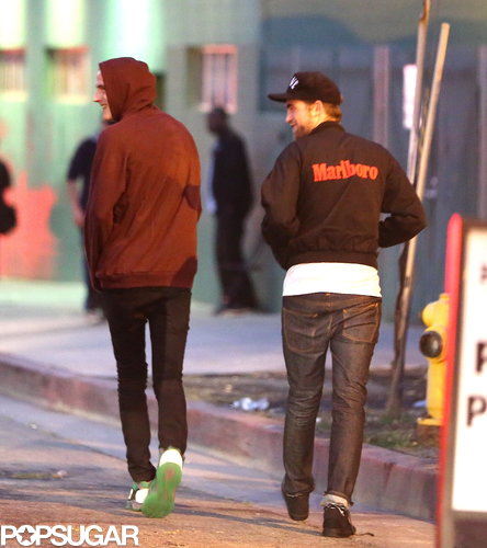 Robert Pattinson walked through the parking lot.
Robert Pattinson walked through the parking lot.