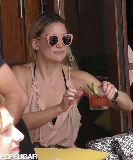 These peach Karen Walker sunglasses ($250) matched Kate Hudson's pretty peach dress perfectly during a family vacation in Barcelona.
These peach Karen Walker sunglasses ($250) matched Kate Hudson's pretty peach dress perfectly during a family vacation in Barcelona.