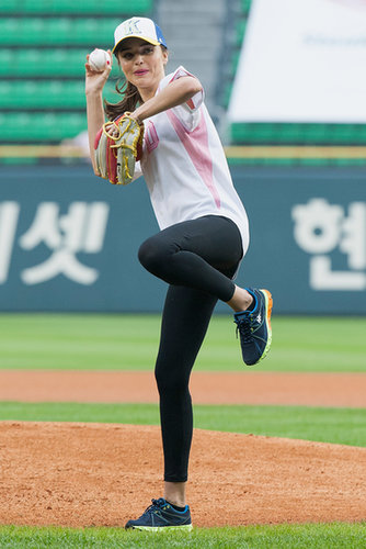 Miranda Kerr fired one past home plate during a baseball game in Seoul, South Korea, in June.
Miranda Kerr fired one past home plate during a baseball game in Seoul, South Korea, in June.